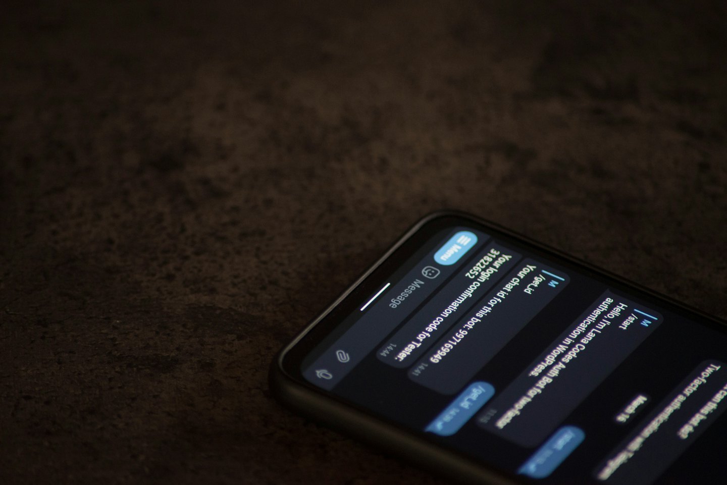 Smartphone screen shows chat with login codes.